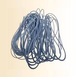 May include: A cluster of intertwined, light blue, curved lines against a soft yellow background. The lines appear to be made of a flexible material, forming a dense, abstract shape. The overall form is rounded and organic.