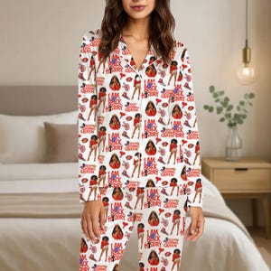 May include: White pajama set with a repeating pattern of illustrations and text. The design includes images of women, high heels, and the phrases "I AM BLACK HISTORY QUEEN" and "KEEP GOING QUEEN".