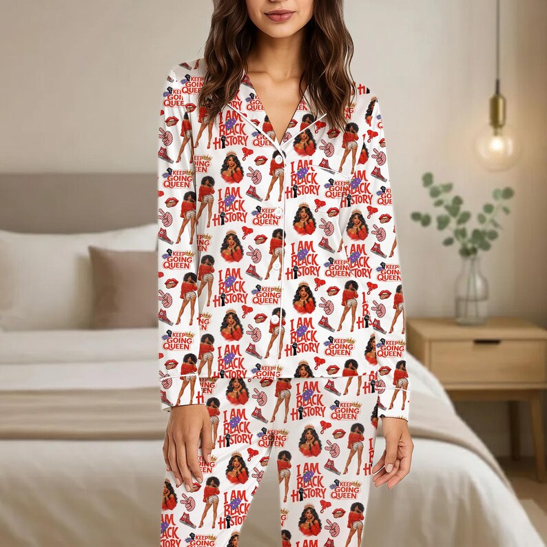 May include: White pajama set with a repeating pattern of illustrations and text. The design includes images of women, high heels, and the phrases "I AM BLACK HISTORY QUEEN" and "KEEP GOING QUEEN".