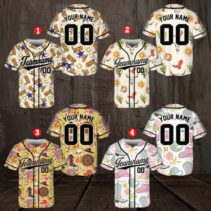 May include: Five baseball jerseys with different colorful patterns. The jerseys are white with a black collar and black trim around the sleeves. The jerseys have a variety of patterns including cacti, cowboy boots, hats, and flowers. The jerseys have the text "Teamname" and "Your Name" on them.