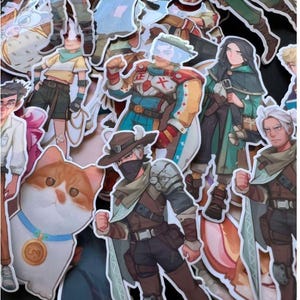 May include: A white ceramic mug with a black handle and the text "But First, Coffee" in a black, bold font. The mug is on a white surface.