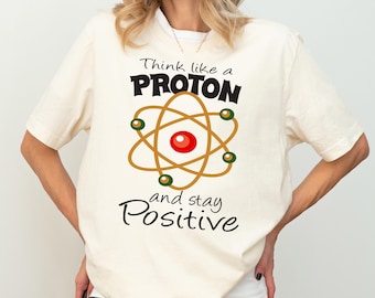 Think Like A Proton And Stay Positive Science Teacher Shirt, Science Shirt, Chemistry Shirt, Atom Symbol Long Sleeve, Science Lover T-shirt