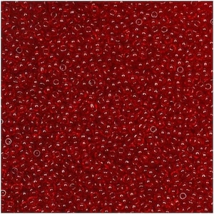 May include: A close-up of numerous small, transparent, red beads. The beads are closely packed, forming a textured surface. The colour is a deep, rich red, with light reflecting off them. These beads are suitable for jewellery making and crafts.