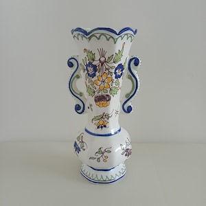 Small vintage Moustiers earthenware vase, floral pattern