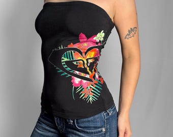 May include: A black strapless tube top featuring a large, stylised heart graphic on the front. The design incorporates vibrant floral patterns in shades of pink, orange, and green, accented with small, reflective silver studs along the heart outline.