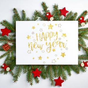 May include: A white card with gold lettering that reads "HAPPY New Year" is surrounded by evergreen branches, red star ornaments, and small red and gold decorations. The card is decorated with gold and silver stars.