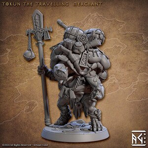 May include: A grey, detailed miniature figurine of a creature carrying a staff and many bags. The creature has a large head with a snout and is wearing a loincloth. The figurine is standing on a round base.