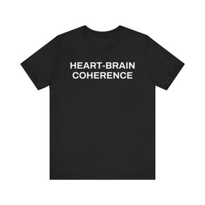 May include: Black t-shirt with the white text "HEART-BRAIN COHERENCE" in a sans-serif font. The shirt has short sleeves and a crew neck. The fabric appears to be a soft, comfortable material.