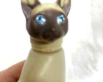 We are Siamese if you please.....aristocats, Siamese cat figure with blue rhinestone eyes! Collectible Avon Cotillion Cologne, kitty cats