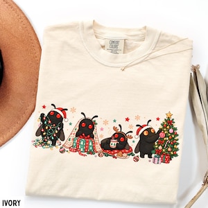 Christmas Mothman Shirt Merry Mothmas festive Cryptid Shirt Book Lover Gift Dark Academia Funny Reading Tee Bookworm Gift