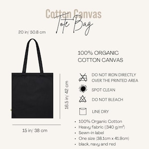 May include: Black cotton canvas tote bag with the text "Cotton Canvas Tote Bag". The bag is 20 inches tall, 15 inches wide, and made of 100% organic cotton. It features a sewn-in label and is available in black, navy, and red.