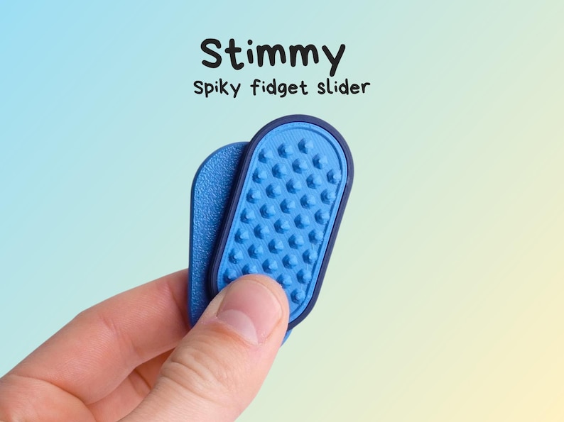 May include: A blue spiky fidget slider with the word "Stimmy" above it. The slider is held in a hand and has a textured surface with small, rounded bumps. The background is a gradient of blue and yellow.