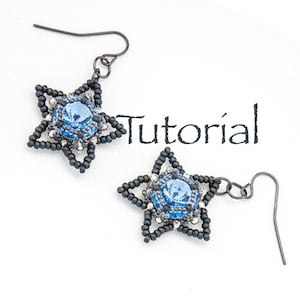 May include: A pair of star-shaped earrings with blue crystal accents and black beading. The earrings are attached to silver hooks. The word "Tutorial" is written in black text on a white background.