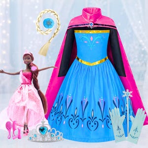 May include: A blue and pink princess dress with a matching cape, gloves, and a wand. A doll in a pink dress, a tiara, and a hair accessory are also included. A blonde braid with a blue accent completes the set. Perfect for dress-up and imaginative play.