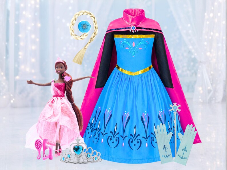 May include: A blue and pink princess dress with a matching cape, gloves, and a wand. A doll in a pink dress, a tiara, and a hair accessory are also included. A blonde braid with a blue accent completes the set. Perfect for dress-up and imaginative play.