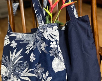 Reversible tote bags crafted with love by a Thai volunteer community. Carry one of these bags, and you carry the spirit of a community