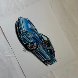 May include: A detailed illustration of a blue sports car with a lowered suspension and custom wheels. The artwork features shading and highlights to give the car a realistic appearance. The car's interior is visible through the open door.