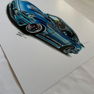 May include: A detailed illustration of a blue sports car with a low profile and custom wheels. The artwork features shading and highlights, giving the car a three-dimensional appearance. The car has a spoiler and a detailed interior. The artist's signature is visible.