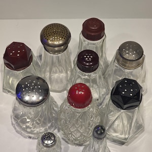 Set of sugar, salt and pepper shakers in glass, Bakelite and metal