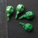 4 green cast glass seed pods 1.25"