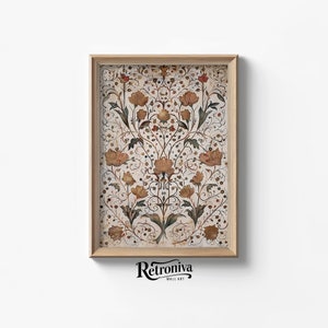 Puede incluir: Una impresión enmarcada con un patrón floral vintage en tonos marrones, amarillos y verdes. El patrón presenta detalles intrincados y un diseño simétrico.
