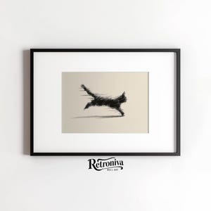 May include: Black and white framed wall art featuring a stylized, blurred image of a running cat. The artwork is set against a neutral background, with the cat's form rendered in a dynamic, abstract style. The frame is black, and the artwork is signed "Retroniva Wall Art".