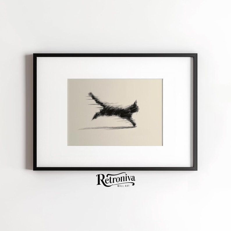 May include: Black and white framed wall art featuring a stylized, blurred image of a running cat. The artwork is set against a neutral background, with the cat's form rendered in a dynamic, abstract style. The frame is black, and the artwork is signed "Retroniva Wall Art".