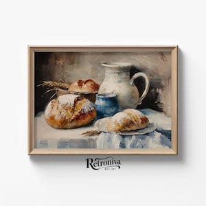 May include: A still life painting of a white pitcher, blue bowl, and four loaves of bread on a white tablecloth with blue stripes. The painting is framed in a light wood frame.