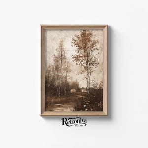 May include: A framed sepia-toned painting of a rural landscape with two trees and a small house in the distance. The trees are bare and the sky is cloudy.