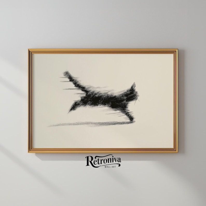 May include: A framed art print featuring a black, sketched image of a running cat with motion blur. The artwork is set against a cream-colored background and framed in a gold-colored frame. The bottom of the frame has the text "Retroniva Wall Art".
