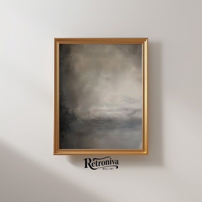 The painting of abstract art is displayed in a modern golden frame with a earthy abstract art.