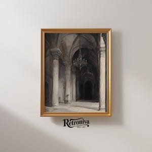 The watercolor architectural scene is displayed in a modern golden frame with the moody church art.