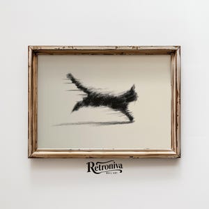 May include: A framed wall art print featuring a black, stylized illustration of a running cat. The artwork has a distressed, vintage-style frame. The print is on a cream-colored background. The text "Retroniva Wall Art" is at the bottom.
