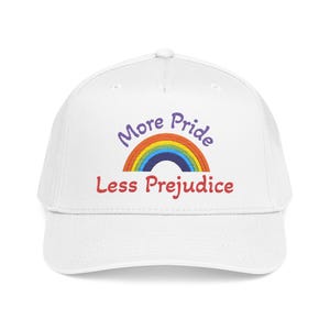 May include: A white baseball cap with the text "More Pride Less Prejudice" in purple and red, with a rainbow graphic. The cap is a classic six-panel design with a curved brim.