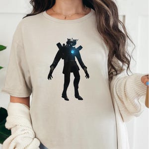 Skibidi Toilet T-shirt, Cameraman Titan Shirt, Titan T-shirt, Skibidi T-shirt, Skibidi Toilet Gift, Skibidi Tolilet Titan Cameraman Gift