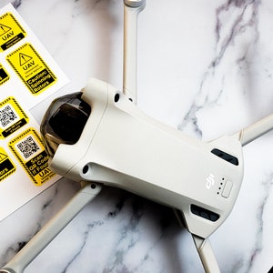 UAV ID / Caution Sticker Set with FAA Registration Number for drones, remote controls, tools, carrying cases, bags, cases, and more.