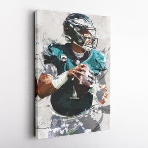 May include: Canvas art print of a football player in a teal and white uniform, holding a football. The player is wearing a black helmet with a white eagle logo. The background has gray and white paint splatter effects.