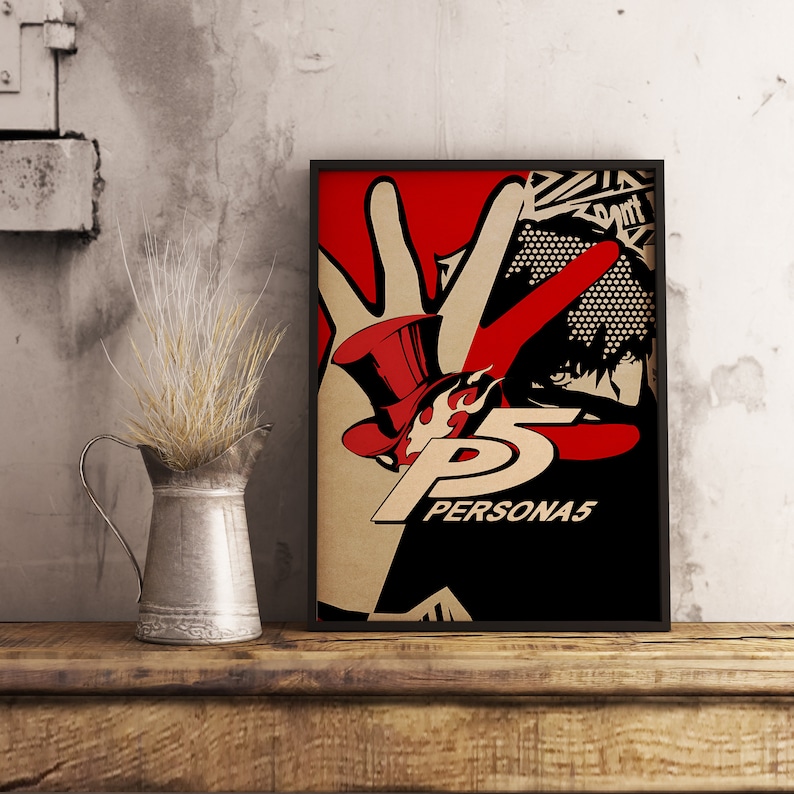 May include: A black framed poster with a red and white illustration of a hand with a top hat and the text "PERSONA5".