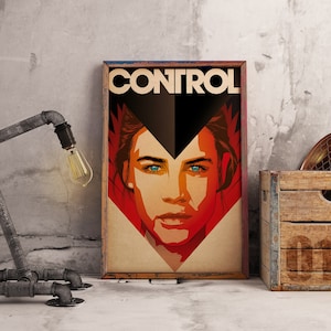 May include: A framed art print featuring a stylized portrait of a woman with striking blue eyes. The word "CONTROL" is displayed at the top. The artwork uses a bold color palette of red, black, and beige, creating a graphic and impactful design.