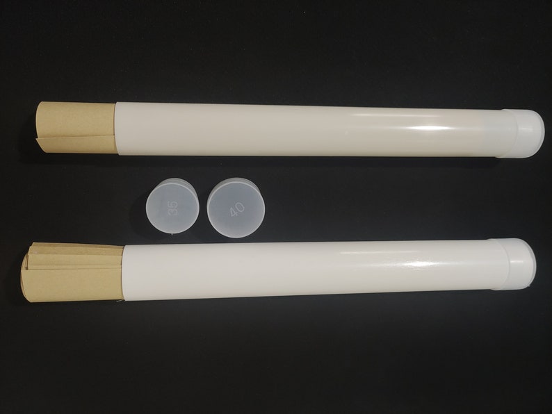 May include: Two white poster tubes with brown paper inserts and clear plastic end caps. The end caps have the numbers 35 and 40 printed on them.