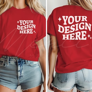 May include: A red t-shirt with the text "YOUR DESIGN HERE" in white on the front and back. The shirt is short-sleeved and has a relaxed fit. The model is wearing denim shorts.