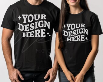 May include: Two black t-shirts with the text "Your Design Here" in white lettering and a star on either side of the text.