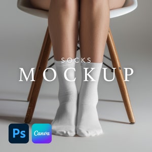 May include: White socks mockup with the text "Socks Mockup" on a white background. The socks are on a person's feet, sitting on a wooden chair.