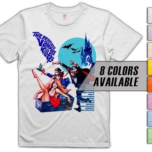 May include: A white t-shirt featuring a graphic print of the movie poster for "The Fearless Vampire Killers". The poster depicts a vampire, a woman, and a coffin. The text "8 COLORS AVAILABLE" is printed on a black rectangle in the bottom right corner of the image.