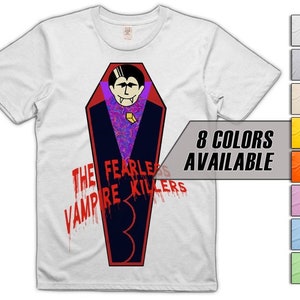 May include: White t-shirt with a cartoon vampire in a coffin design. The graphic includes the text "THE FEARLESS VAMPIRE KILLERS 3" in red. The image also shows a colour palette with "8 COLOURS AVAILABLE".