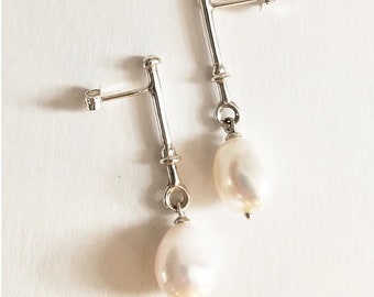 Baroque Pearl Drop column earrings. Baroque wedding statement pearl earrings. Contemporary pearl drop earrings. Pearl stud earrings.