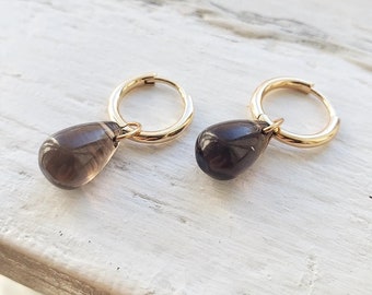 14K Goldfill Huggie hoops with Smoky Quartz amulets. Huggie hoop earrings. Gold huggie hoops. Gold huggie earrings. Protective smoky quartz.