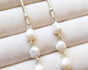 Baroque pearl drop amulet earrings in sterling silver. Baroque freshwater pearl drop earrings. Baroque pearl statement earrings.