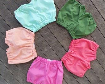 Spring bloomers for baby sizes 0-3 months through girls size 3, shorties in mint, fern green, petal pink, peach blossom, watermelon/coral