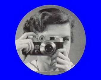 Vintage woman with camera button